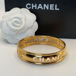 CHANEL Gold Cut Out Logo Bangle